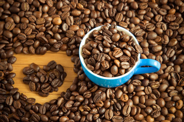 Cup of coffee on beans