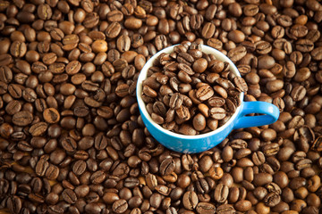 Cup of coffee on beans