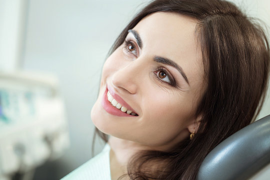 Beautiful Woman smile close up. Healthy Smile. Beautiful Female Smile . Orthodontic Treatment. Dental care Concept. Alignment of teeth