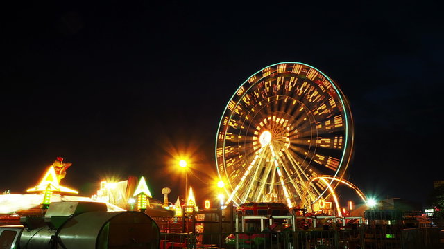 Time lapse twilight shot of funfair amusement park. UHD 4k.

