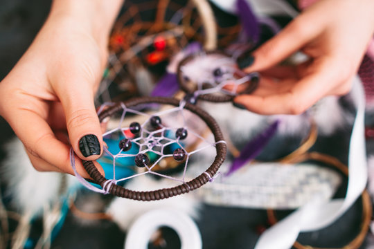 woman holds beautiful Dreamcatcher 