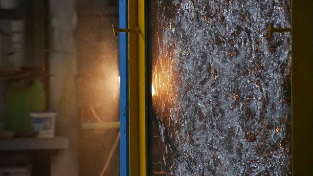Beaten Glass Sheet, Beaten by Stick, Sheet of Glass is in Metal Frame, Stand, Cracks on the Glass, Testing of Bulletproof Glass
