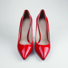 female red shoes over white