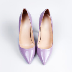 Purple female shoes over white