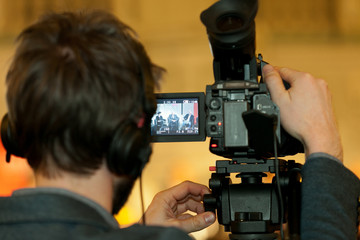 cameraman filming an event
