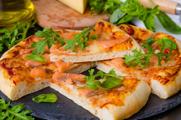 pizza with smoked salmon and arugula