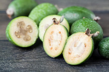 Feijoa on a dark wood background. selective focus