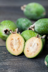 Feijoa on a dark wood background. selective focus
