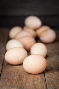 Chicken fresh brown eggs on wooden rustic table