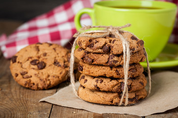 freshly baked chocolate chip cookies on rustic wooden table