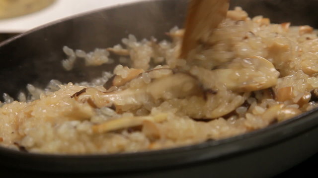 Cooking risotto with mushrooms