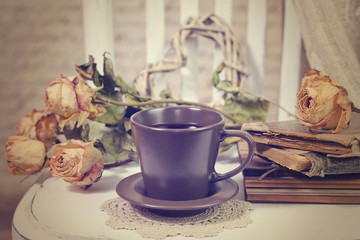 Vintage old books, roses and cup of coffee