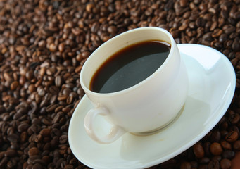 Coffee beans with white cup