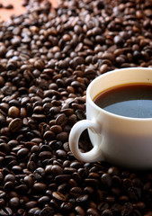 Coffee beans with white cup