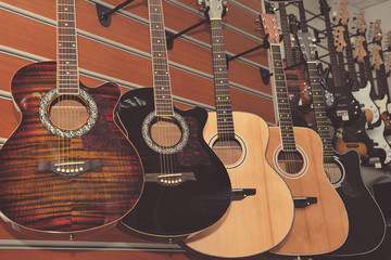 Fototapeta na wymiar Guitars in the store background