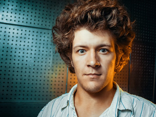 Shocked man with uncombed curly hair