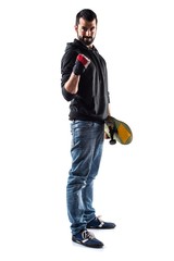 Naklejka premium Lucky man with skateboard