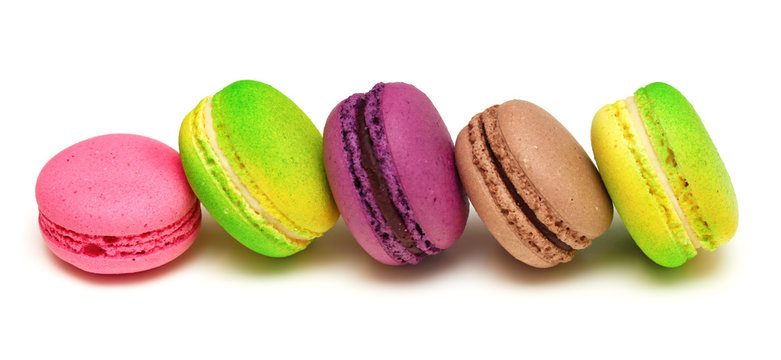 Macaroons row on white background