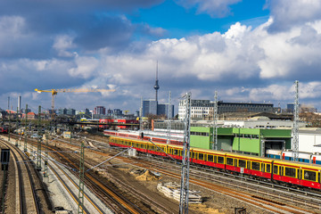Fototapeta na wymiar railway tracks going through the city center of Berlin, with cityscape in the background