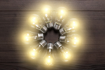 glowing bulbs on wooden background