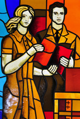Image people with book of a multicolored stained glass window wi