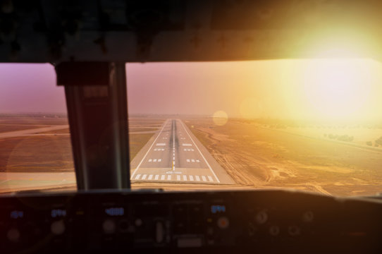 Final approach during sunset. View from flight deck