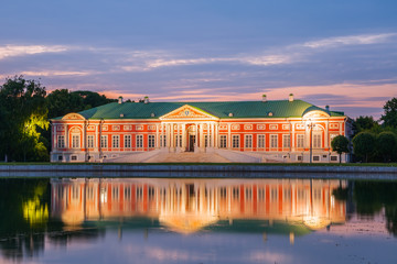 Night view of the Kuskovo park. Kuskovo Palace and reflection in pond. Kuskovo was the summer country house and estate of the Sheremetev family. HDR image. Moscow, Russia. - obrazy, fototapety, plakaty