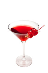 Red cocktail with two cherries. Isolated on white