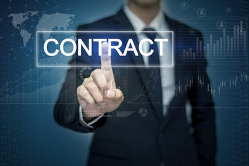 Businessman hand touching CONTRACT button on virtual screen