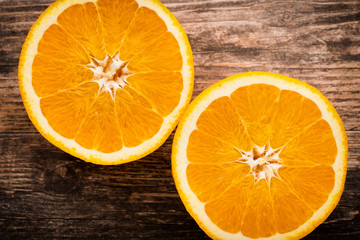 Orange slice on the grey  background.