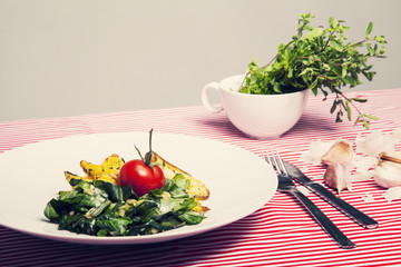 The healthy food - vegetarian meal with spinach, potatoes and he