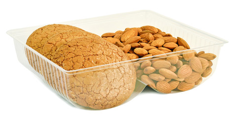 round cookies with almonds in a plastic form
