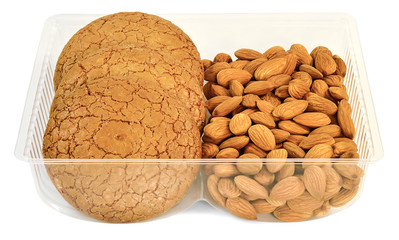 round cookies with almonds in a plastic form