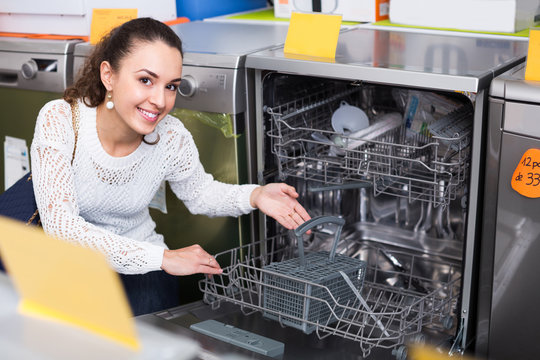 female customer looking at dishwashers