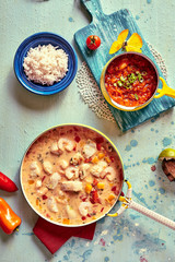 Tasty Brazilian cuisine in pot and bowls