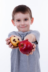 Fototapeta na wymiar little boy with food isolated on white background - apple or a m