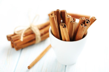 Cinnamon on a blue wooden background