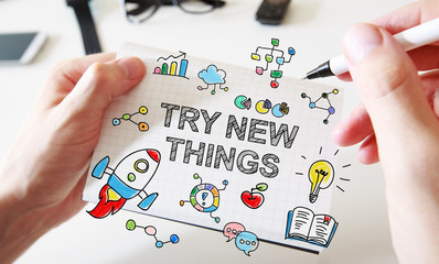 Try new things concept on white notebook