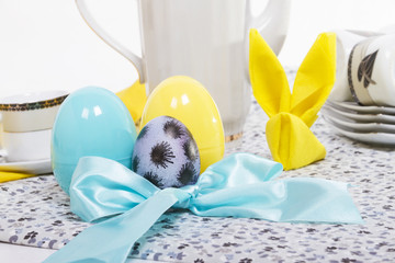Three eggs and yellow bunny napkin