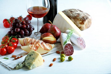 Still life with various types of Italian food and wine