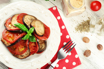 Ratatouille on plate, on table background
