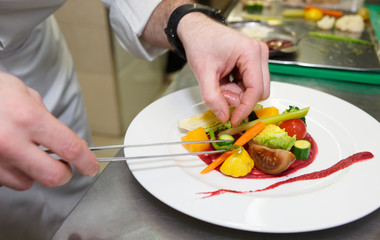 Chef is decorating appetizer