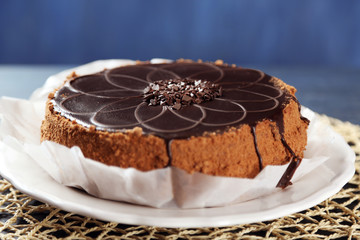 Tasty chocolate cake on wooden background