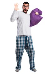 Man in pajamas doing surprise gesture