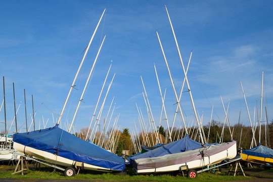 Large group of sailing boats stored on trailers