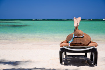 Young woman relaxing on tropical carribean beach