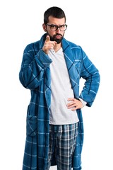 Man in dressing gown having doubts