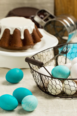 Decoration of Easter cake and eggs in blue tones. Vintage style.