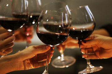 Glasses of red wine on a cheerful holiday