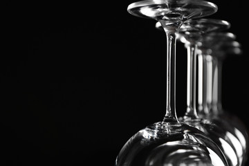 Empty wine glasses on black background, closeup